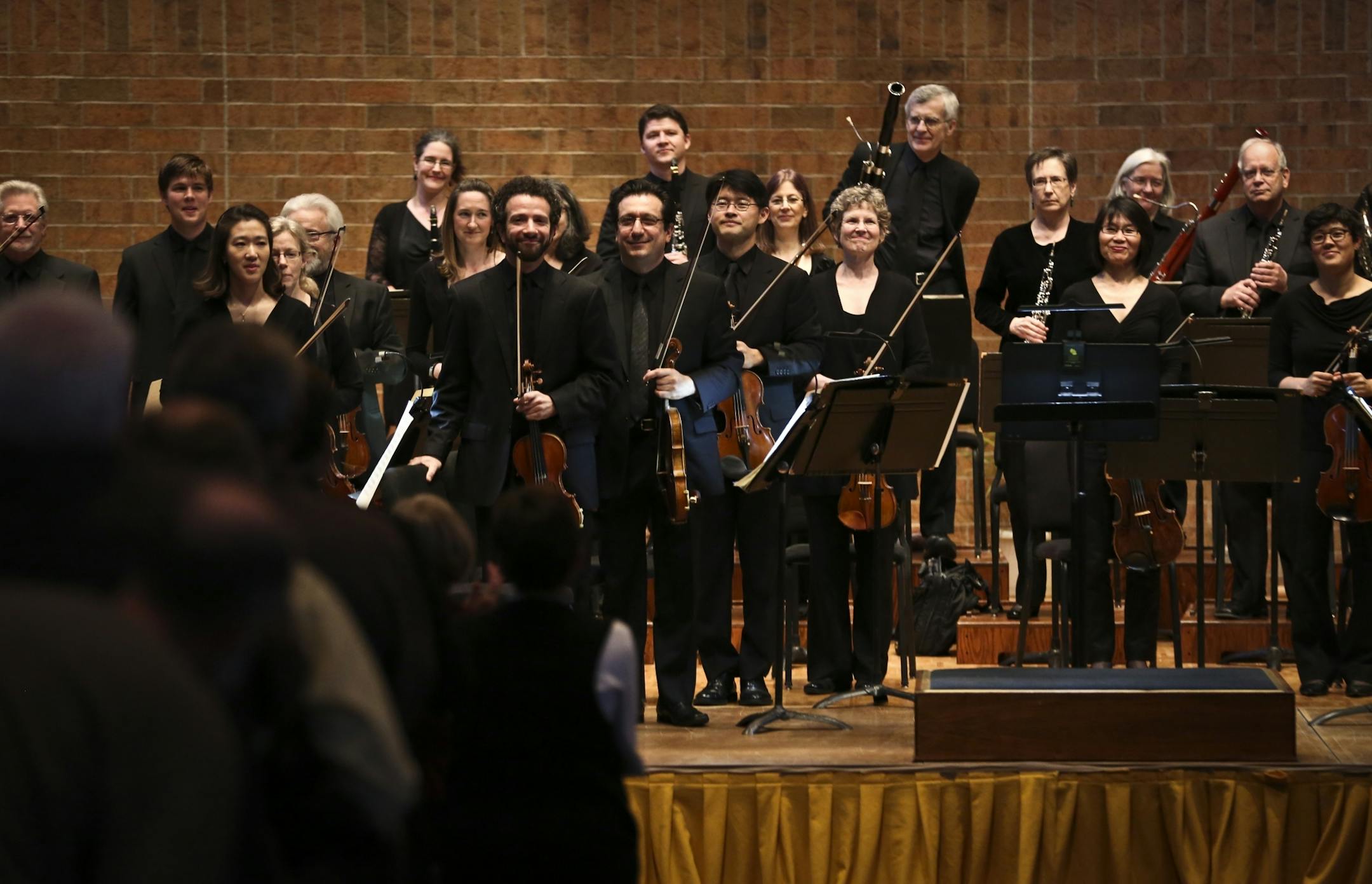 The St. Paul Chamber Orchestra stood in front of a standing audience at the beginning of the first concert since their contract settlement at Shepard of the Valley Church in Apple Valley, Minn. on Thursday, May 9, 2013.