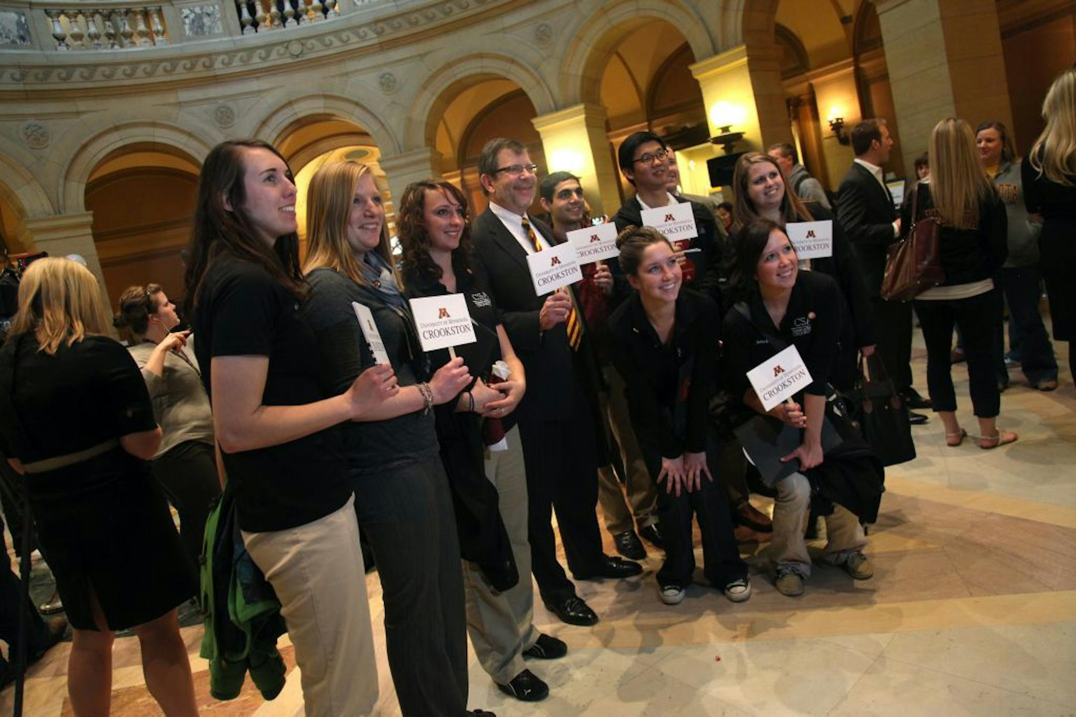University President Eric Kaler, center, posed with Crookston students