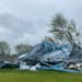 A pole shed destroyed by a powerful storm Monday was seen Tuesday, May 31, outside Forada, Minn.