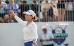 Minjee Lee reacts after sinking a birdie putt on the 18th green in the second playoff hole to win the LPGA Kroger Queen City Championship golf tournam