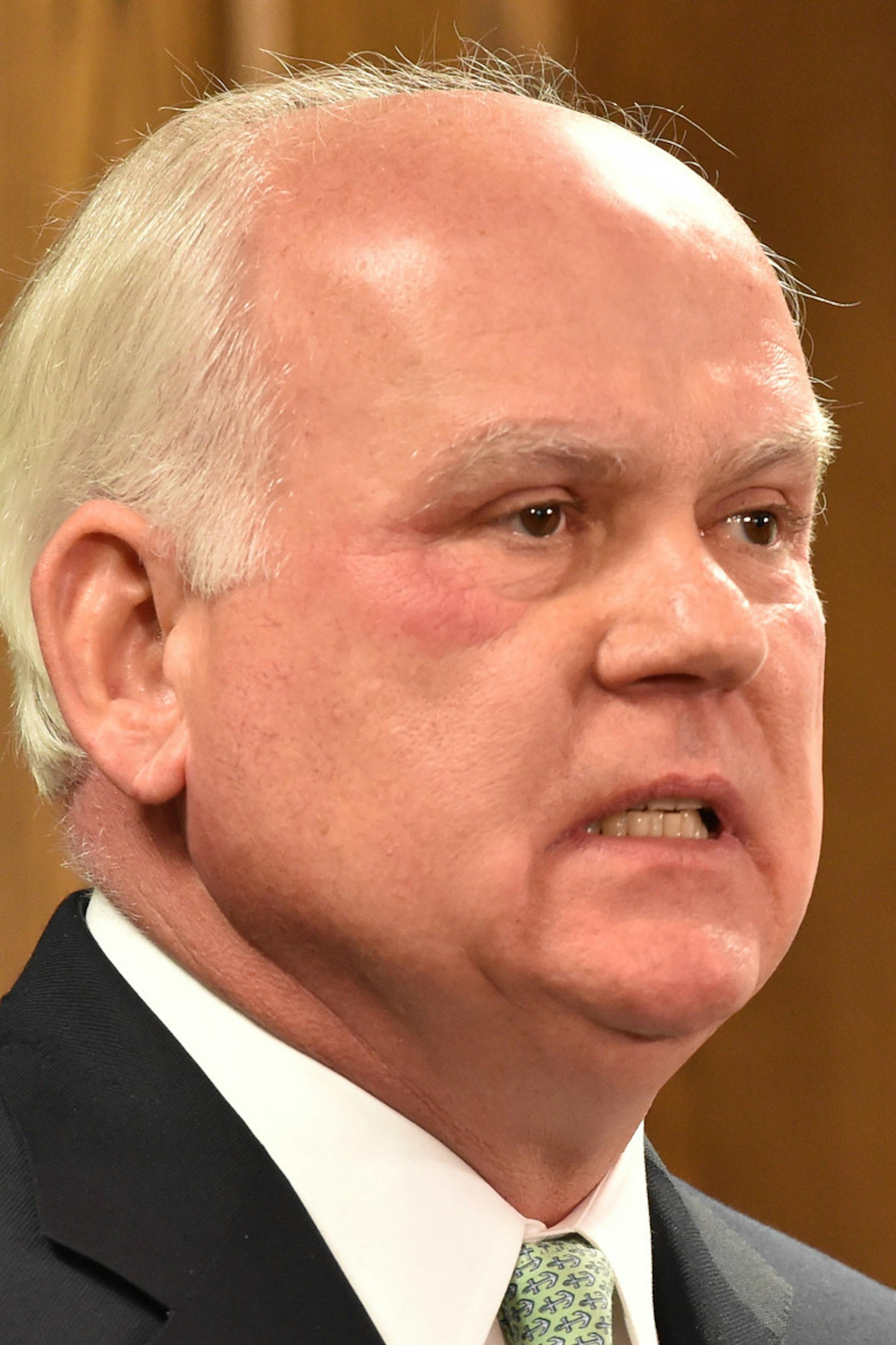 FILE - In this Friday, Jan. 9, 2015, file photo, UAB President Ray Watts holds a news conference in Birmingham, Ala. Watts is bringing the football program back. He told The Associated Press that he decided on Monday, June 1, 2015 to reverse the earlier decision after meetings with UAB supporters continued through the weekend. He says donors have pledged to make up the estimated $17.2 million deficit over the next five years if football is restored. (AP Photo/AL.com, Frank Couch, file) MAGS OUT