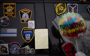 The memorials to three Burnsville first responders killed Feb. 18 continue to grow outside the Burnsville Police Station and City Hall.