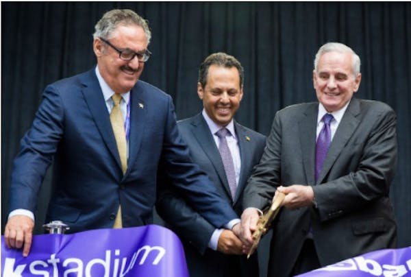 Left to right, Vikings co-owners Zygi and Mark Wilf and Minnesota Gov. Mark Dayton at the grand opening of U.S. Bank Stadium in July 2016.