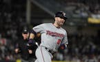 Brian Dozier rounds the bases after hitting a home run in the American League Wild Card playoff game in New York.