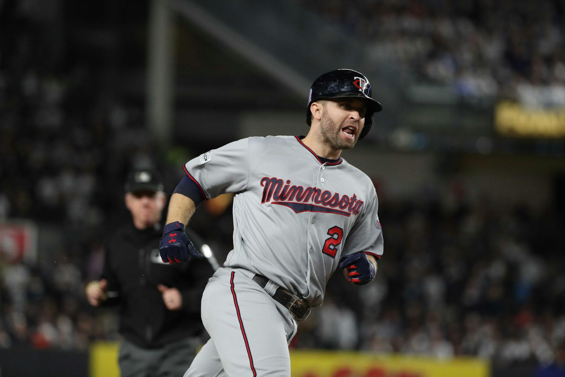 Brian Dozier rounds the bases after hitting a home run in the American League Wild Card playoff game in New York.
