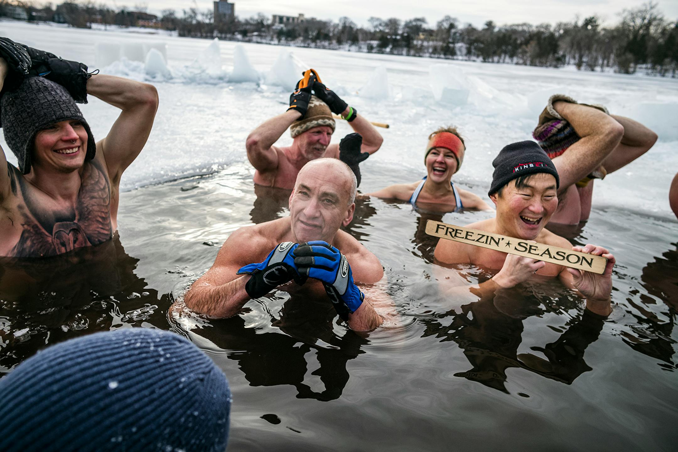 Dane Edward Miller, from left, Leo Royzman, Chad Juncker are all lovers of the ice bath at Cedar Lake in Minneapolis.