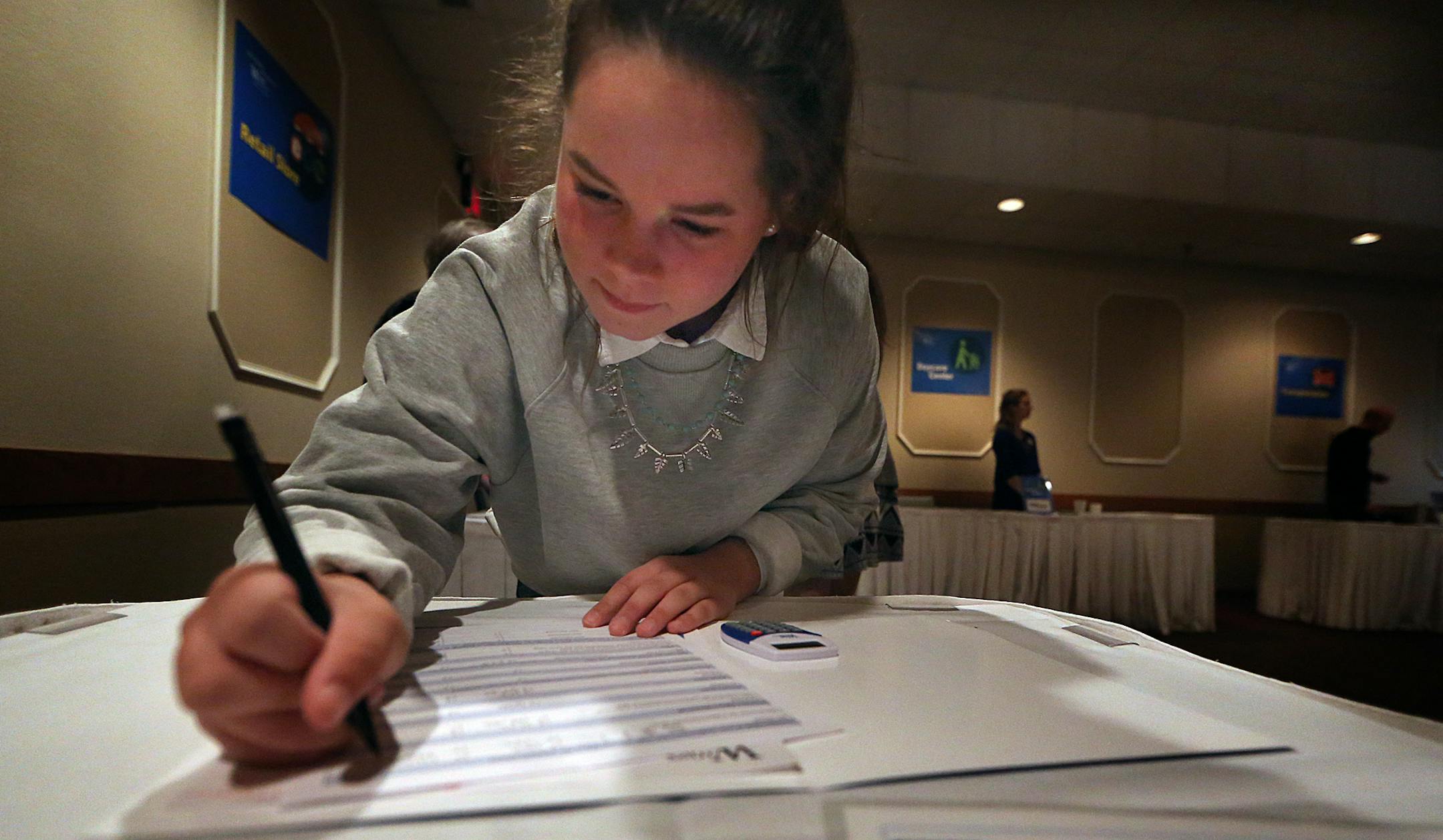 Anna Johnson-Taylor filled out paperwork to determine how much rent she could afford per month for an apartment. ] JIM GEHRZ ï james.gehrz@startribune.com / Eagan, MN / April 27, 2016 /10:00 AM ñ BACKGROUND INFORMATION: Apple Valley High School freshmen students will get a financial reality check when they attend the Reality Fair, an event that puts them through a role playing exercise so they can see the results of their financial decisions. Hundreds of students will go through a role