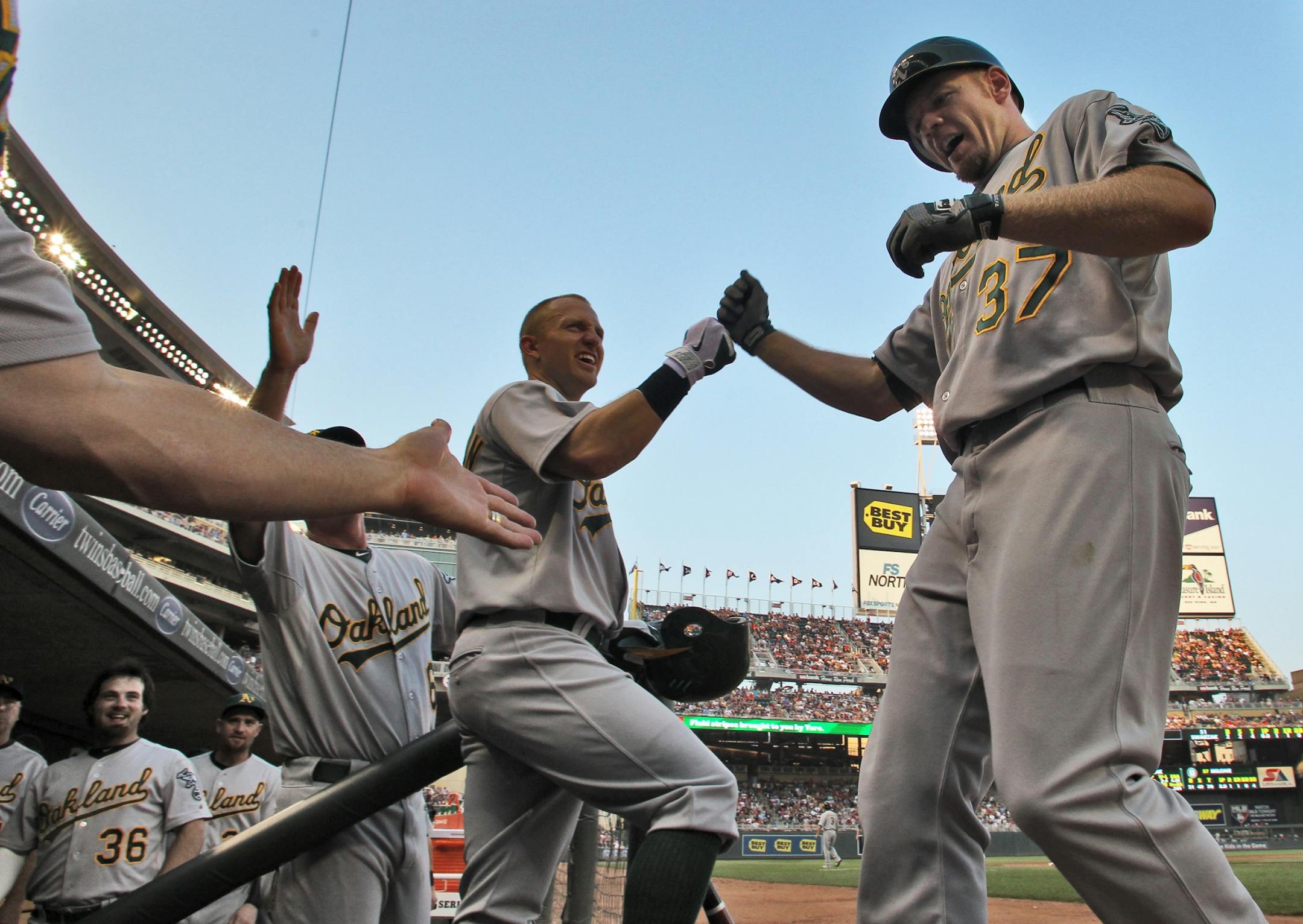 Minnesota Twins vs. Oakland Athletics. Oakland's Brandon Moss (37) was congratulated by teammates in the dugout after he hit a home run in the 6th inning. (MARLIN LEVISON/STARTRIBUNE(mlevison@startribune.com