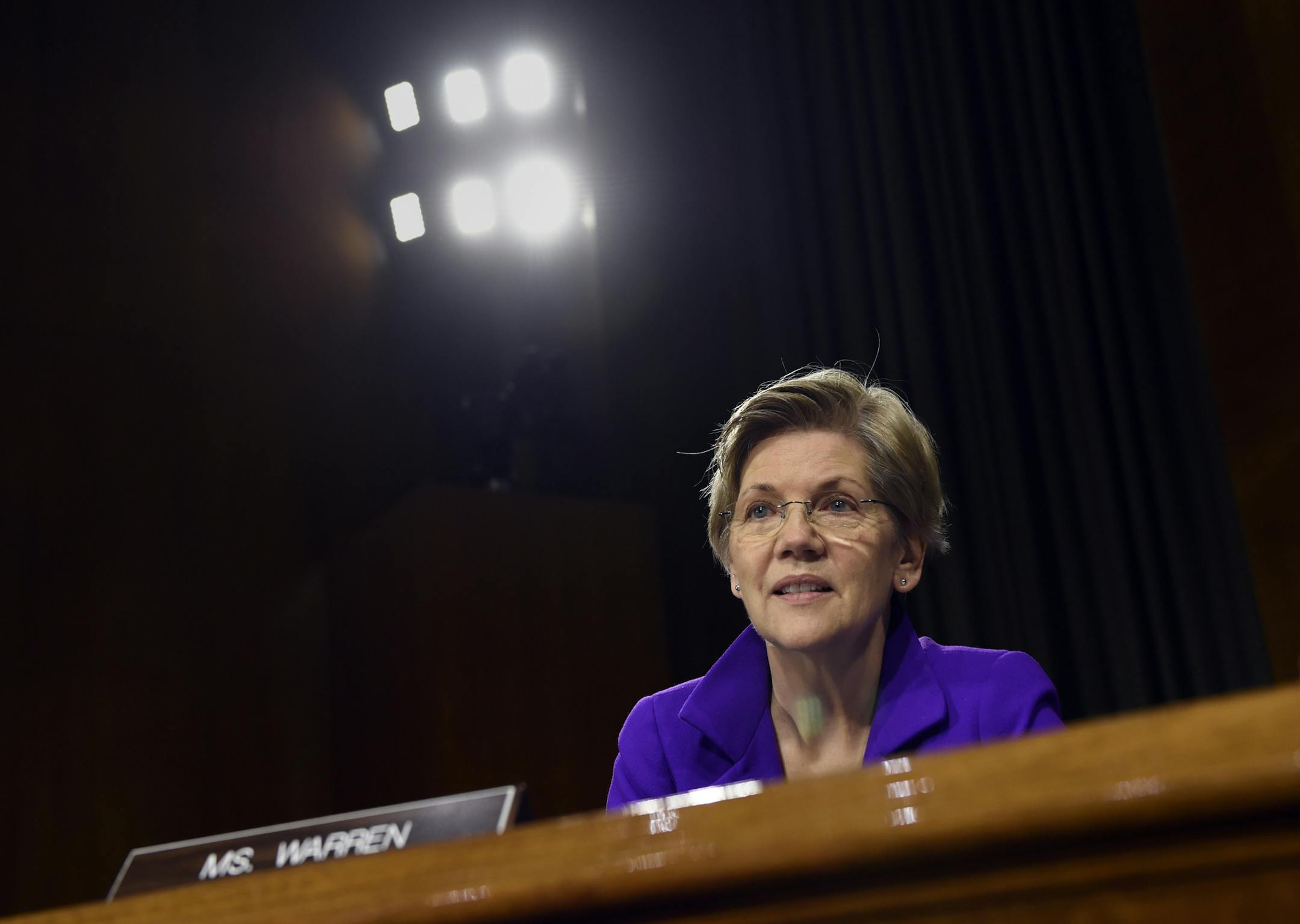 Senate Banking Committee member Sen. Elizabeth Warren, D-Mass., listens to testimony on Capitol Hill in Washington, Tuesday, Feb. 24, 2015, from Federal Reserve Board Chair Janet Yellen. Yellen said Tuesday that the U.S. economy is making steady progress, but the Fed remains patient in raising interest rates because too many Americans are still unemployed, wage growth remains sluggish and inflation is too low. (AP Photo/Susan Walsh)