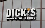 FILE- In this March 1, 2018, file photo, a sign for Dick's Sporting Goods store is displayed at the store in Madison, Miss. Dick's Sporting Goods, Inc