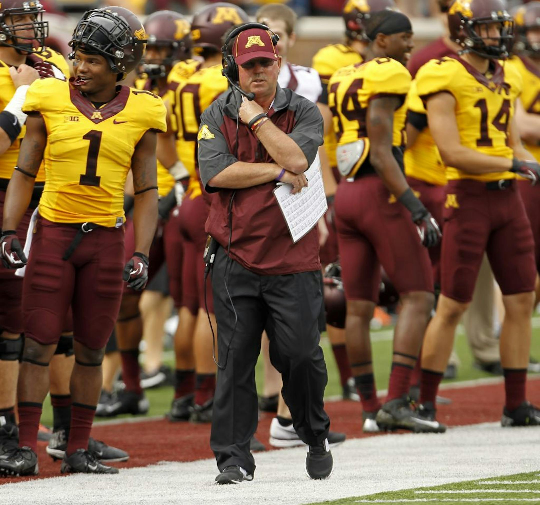 Minnesota head coach Jerry Kill walks the sidelines during the first quarter of an NCAA college football game against Western Illinois in Minneapolis, Saturday, Sept. 14, 2013.