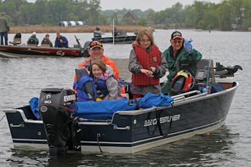 (left to right) Darren Heimbuch, Mary Heimbuch age-6, Katherin Heimbuch age-9, and Barry Heimbuch (grandfather), from Debuque IA, fished in Seaton Lak