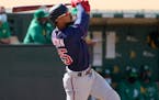 Minnesota Twins' Byron Buxton (25) hits a two run home run against the Oakland Athletics during the tenth inning of a baseball game on Wednesday, Apri