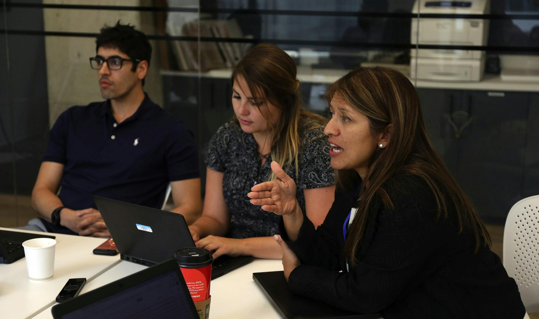 Ana Milena Salamanca, right, and others in Nielsen company's data science team meet at the company's offices in Chicago on Wednesday, June 27, 2018. (Terrence Antonio James/Chicago Tribune)