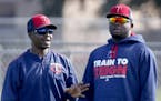 Butch Davis (left, with Miguel Sano) will not be back as first base coach with the Twins in 2017. Hitting coach Tom Brunansky also was let go.