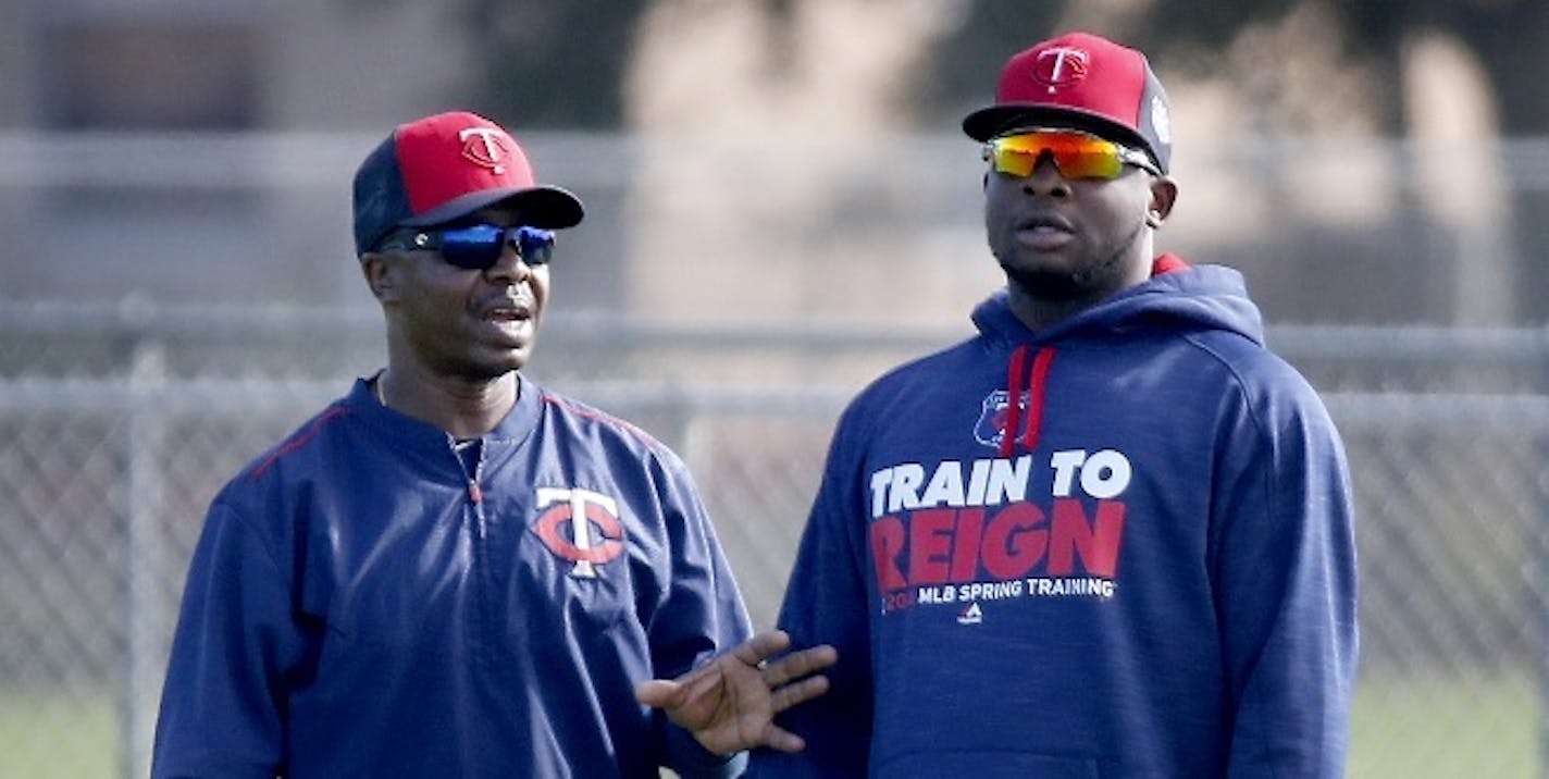 Butch Davis (left, with Miguel Sano) will not be back as first base coach with the Twins in 2017. Hitting coach Tom Brunansky also was let go.