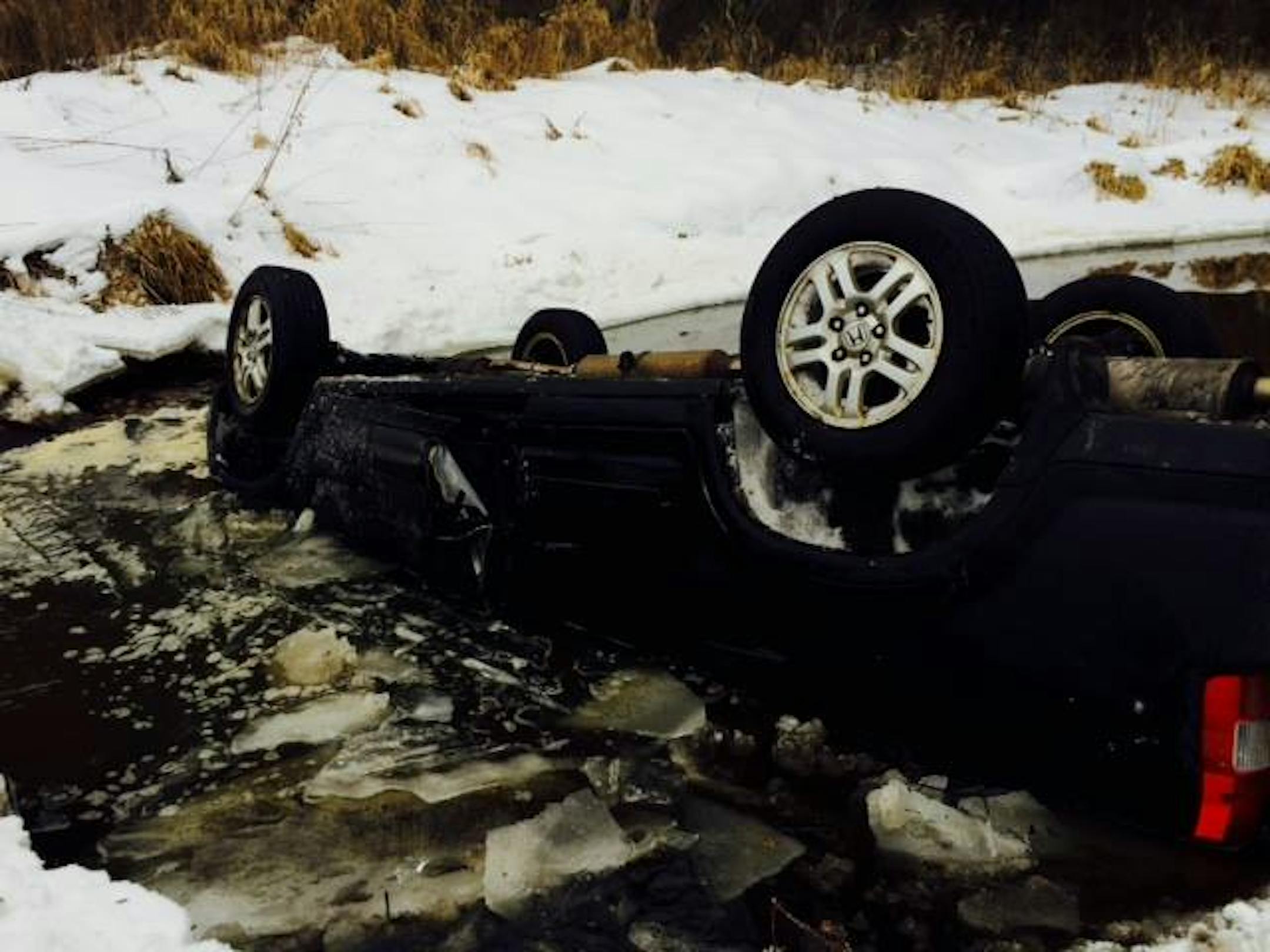 A driver was rescued from this SUV in an Isanti County creek.
