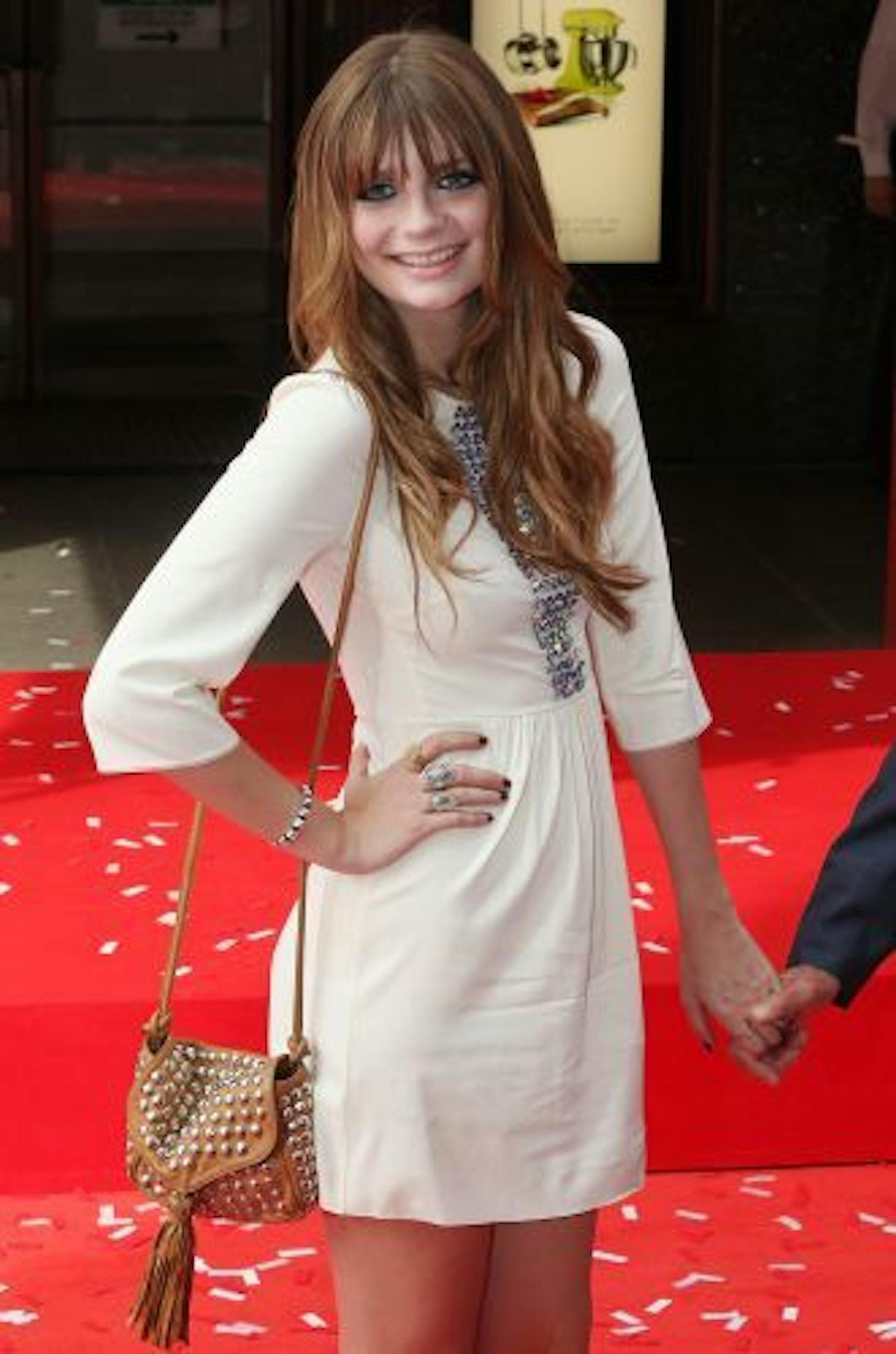 British born actress Mischa Barton, attends the official opening of the Harrods Summer Sale with Harrods store owner Mohamed Al Fayed, not seen, in London, Saturday June 27, 2009.