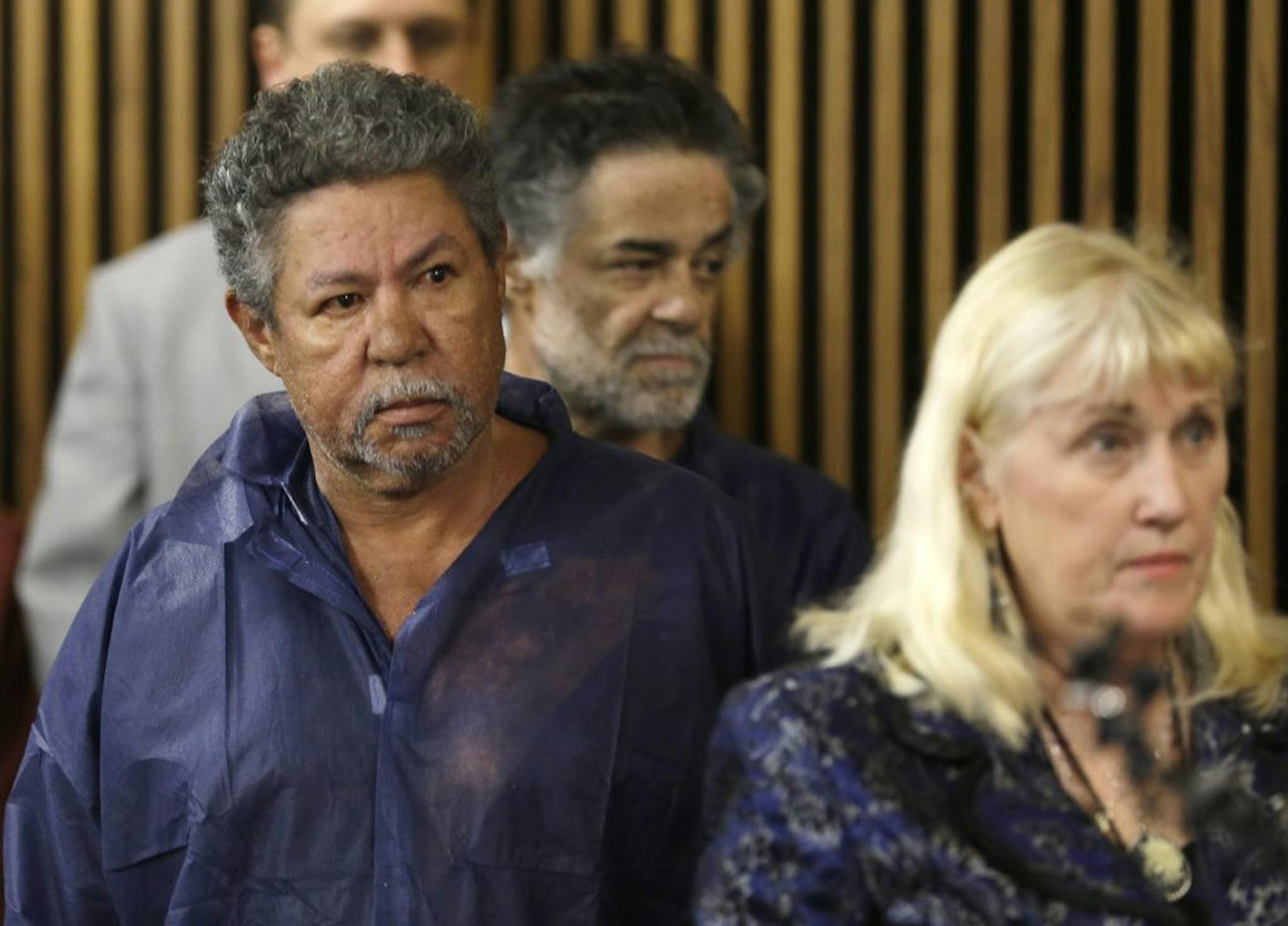 Pedro Castro, left, and Onil Castro, back right, Ariel Castro's Castro's older brothers who've been in custody since Monday, appear in Cleveland Municipal court Thursday, May 9, 2013, in Cleveland. Prosecutors brought no charges against the brothers, citing a lack of evidence. Ariel Castro was arraigned Thursday on charges of rape and kidnapping after three women missing for about a decade and one of their young daughters were found alive at his home earlier in the week. Attorney Kathleen DeMetz
