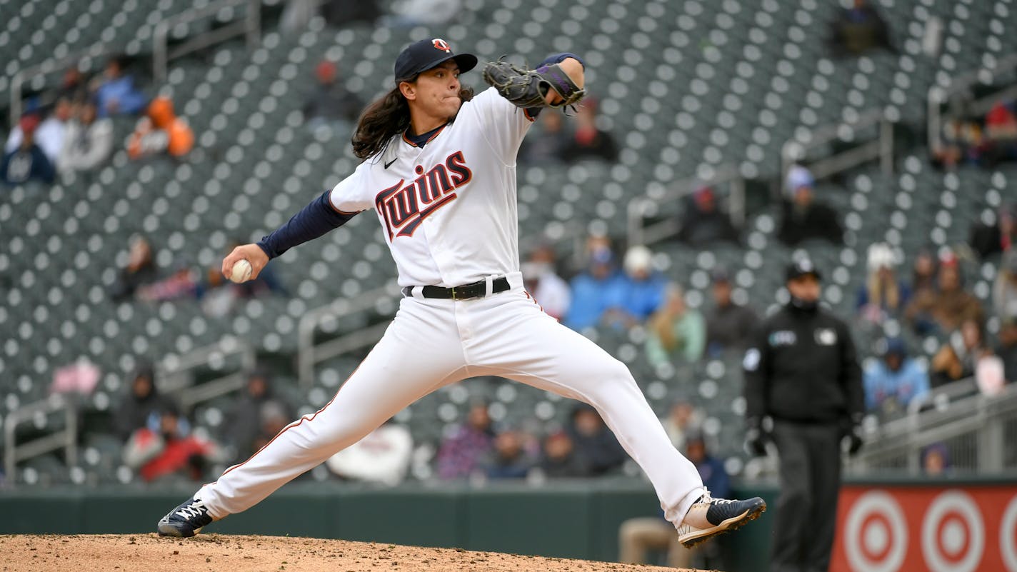 Minnesota Twins pitcher Dereck Rodriguez throws against the Los Angeles Dodgers during the fifth inning of a baseball game, Wednesday, April 13, 2022, in Minneapolis. The Dodgers won 7-0. (AP Photo/Craig Lassig)