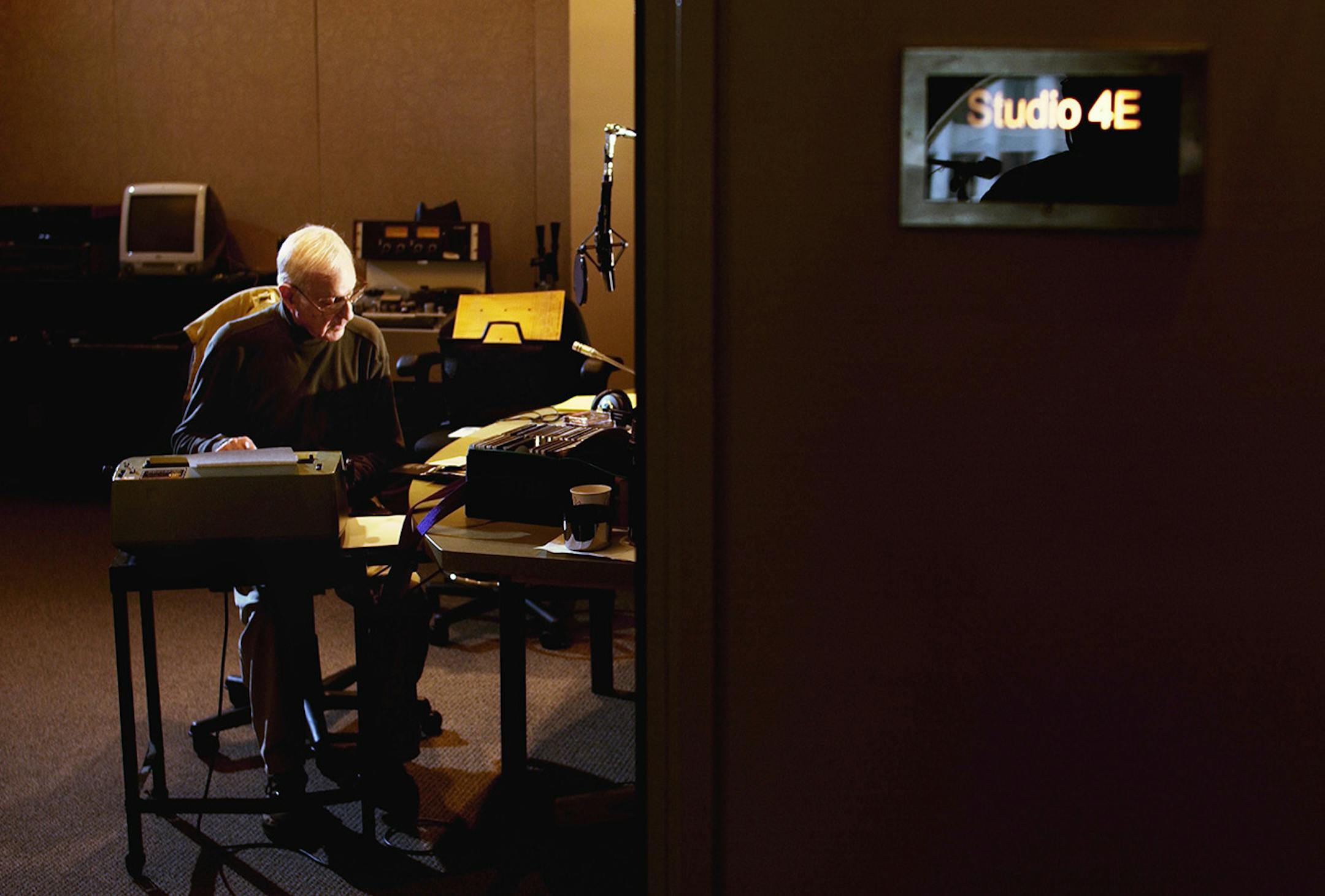 SAT_07/20/02_St.Paul - - - - In studio 4E, Leigh Kamman perpares for his Sat. night MPR program, the Jazz Image. Contrary to others at MPR who use computers for program logs, Leigh uses a more familiar IBM Selectric.