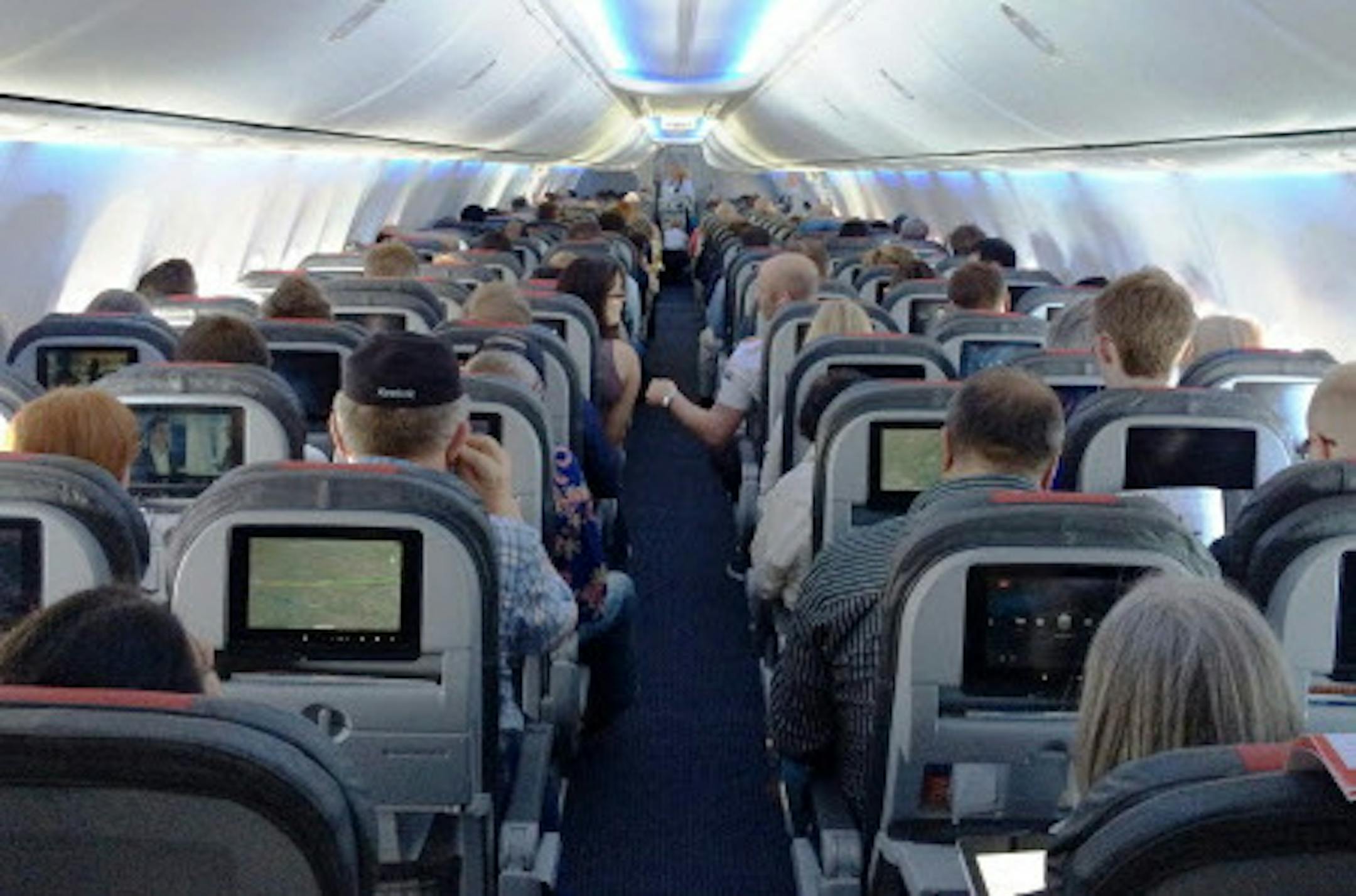 One of American Airlines' new 737s. The cabin gives standard economy passengers less space, but also an entertainment system to distract them. (Josh Noel/Chicago Tribune/MCT) ORG XMIT: 1154887