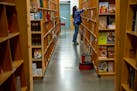 A shopper at the flagship PowellÕs Books store in Portland, Oregon, on Nov. 2, 2021. Like the rest of PortlandÕs urban core Ñ and like downtowns ac