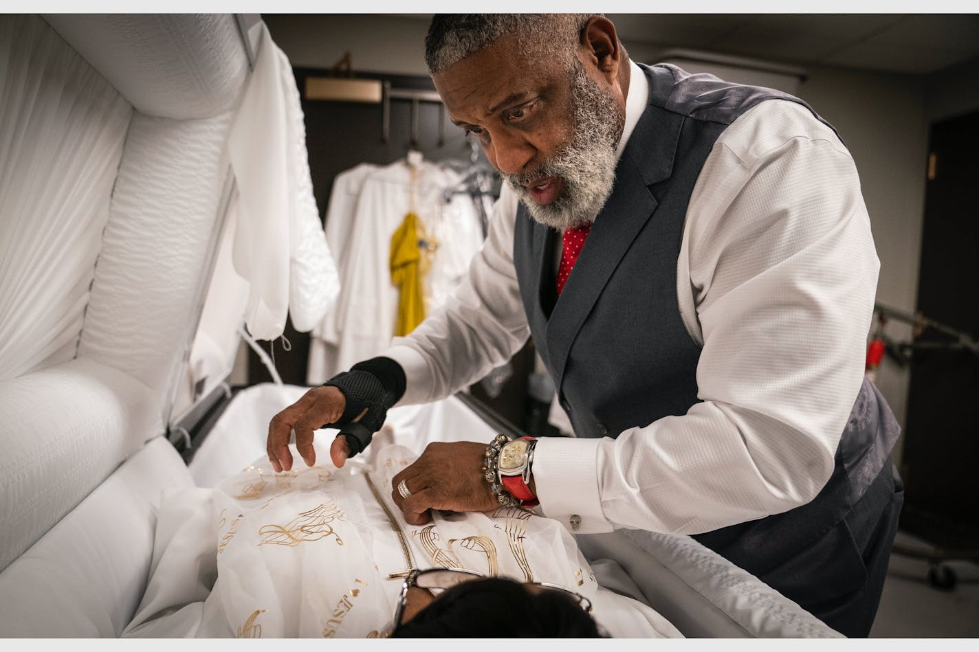 Funeral director Tracy Wesley prepared a body for the family to view earlier this month at Estes Funeral Chapel.