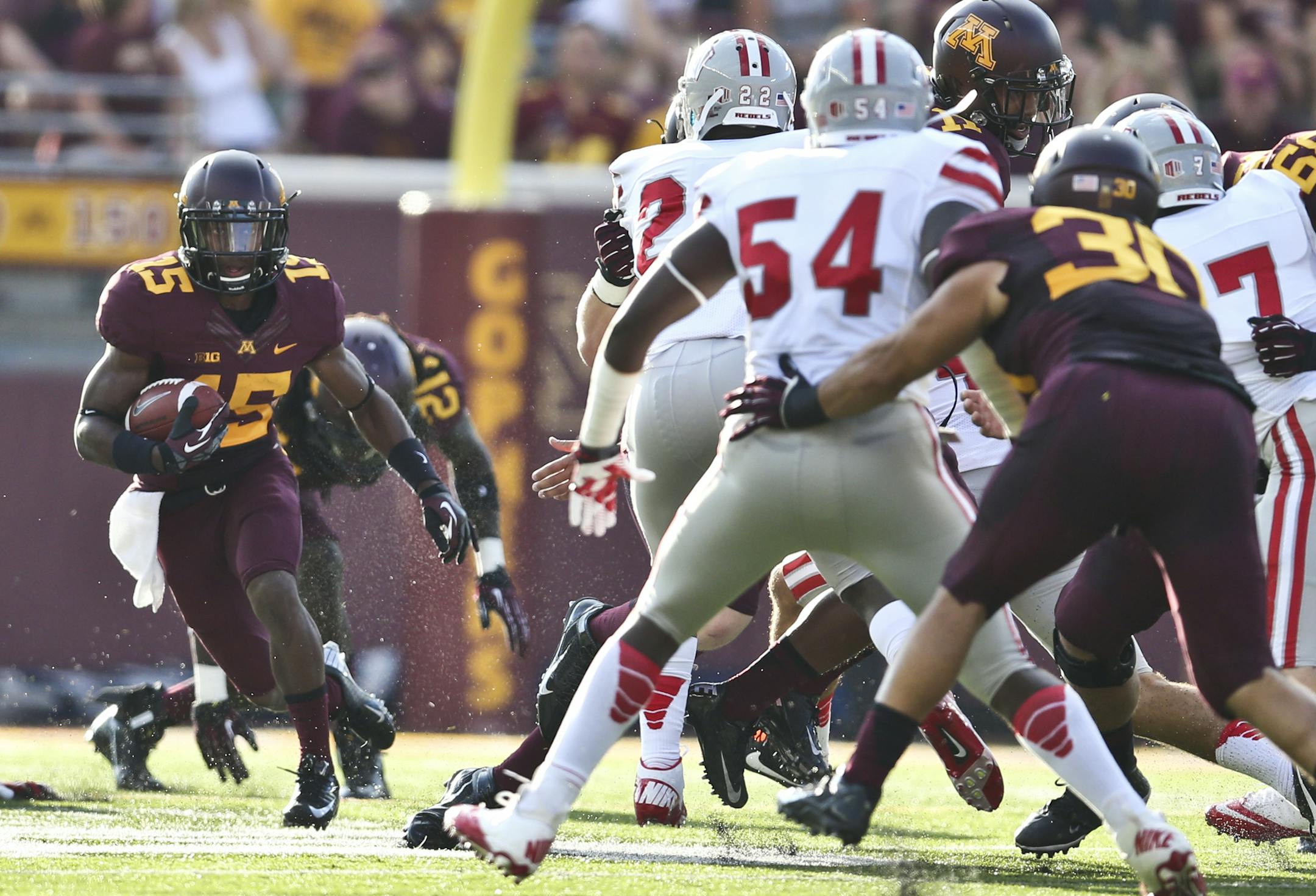 Minnesota Golden Gophers defensive back Marcus Jones (15) ran a 17 yard return on a kick off in the first quarter during the Minnesota Gophers vs. UNLV in the season opener at TCF Bank Stadium at the University of Minnesota in Minneapolis, Minn., on Thursday, August 29, 2013. ] (RENEE JONES SCHNEIDER &#x2022; reneejones@startribune.com)