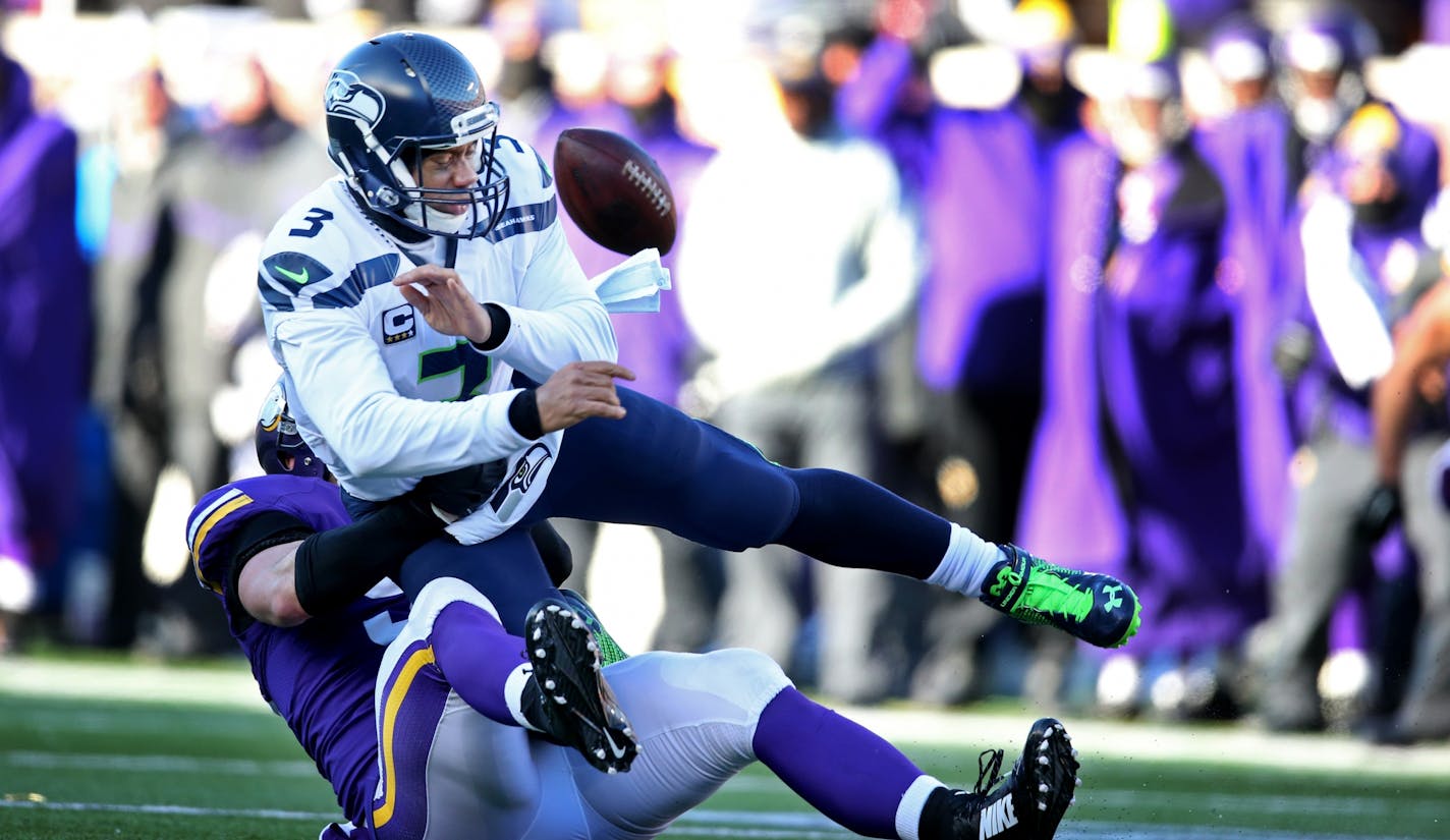 Vikings defensive end Brian Robison pressured Seahawks quarterback Russell Wilson into throwing an incomplete pass Sunday.