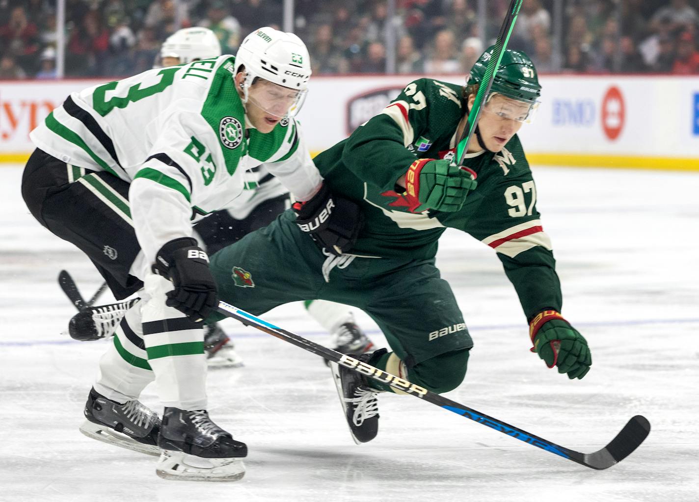 Kirill Kaprizov (97) of the Minnesota Wild and Esa LIndell (23) of the Dallas Stars in the first period during Round 1, Game 4 of the NHL playoffs Sunday, April 23, 2023, at Xcel Energy Center in St. Paul, Minn. ] CARLOS GONZALEZ • carlos.gonzalez@startribune.com.