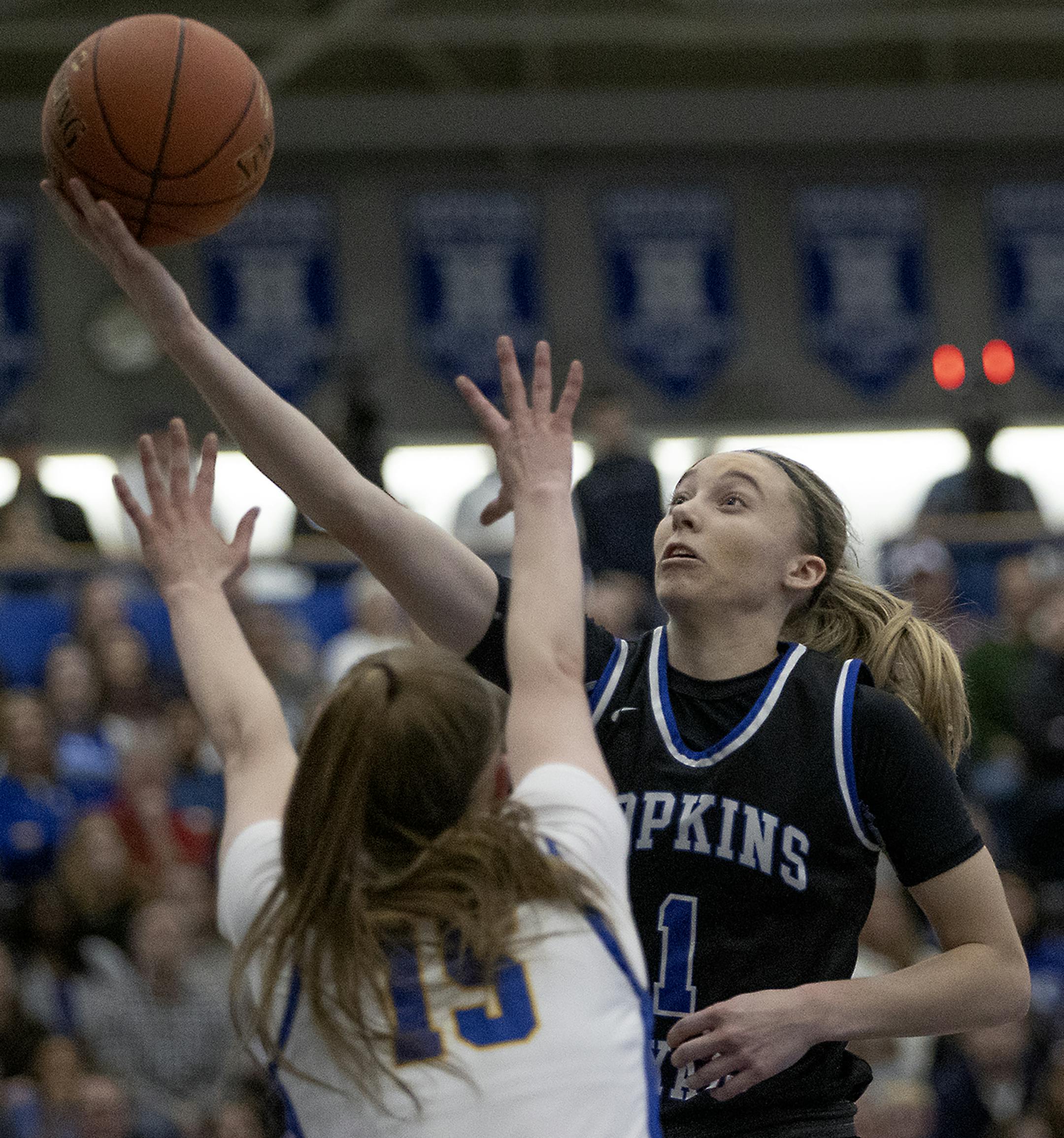Hopkins’ Paige Bueckers went up for two and drew a foul from Wayzata’s Lydia Hay during the second half of their match up in the Class 4A, Section 6 girls' basketball championship at the Lindbergh Center, Thursday, March 5, 2020 in Hopkins, MN. ] ELIZABETH FLORES • liz.flores@startribune.com