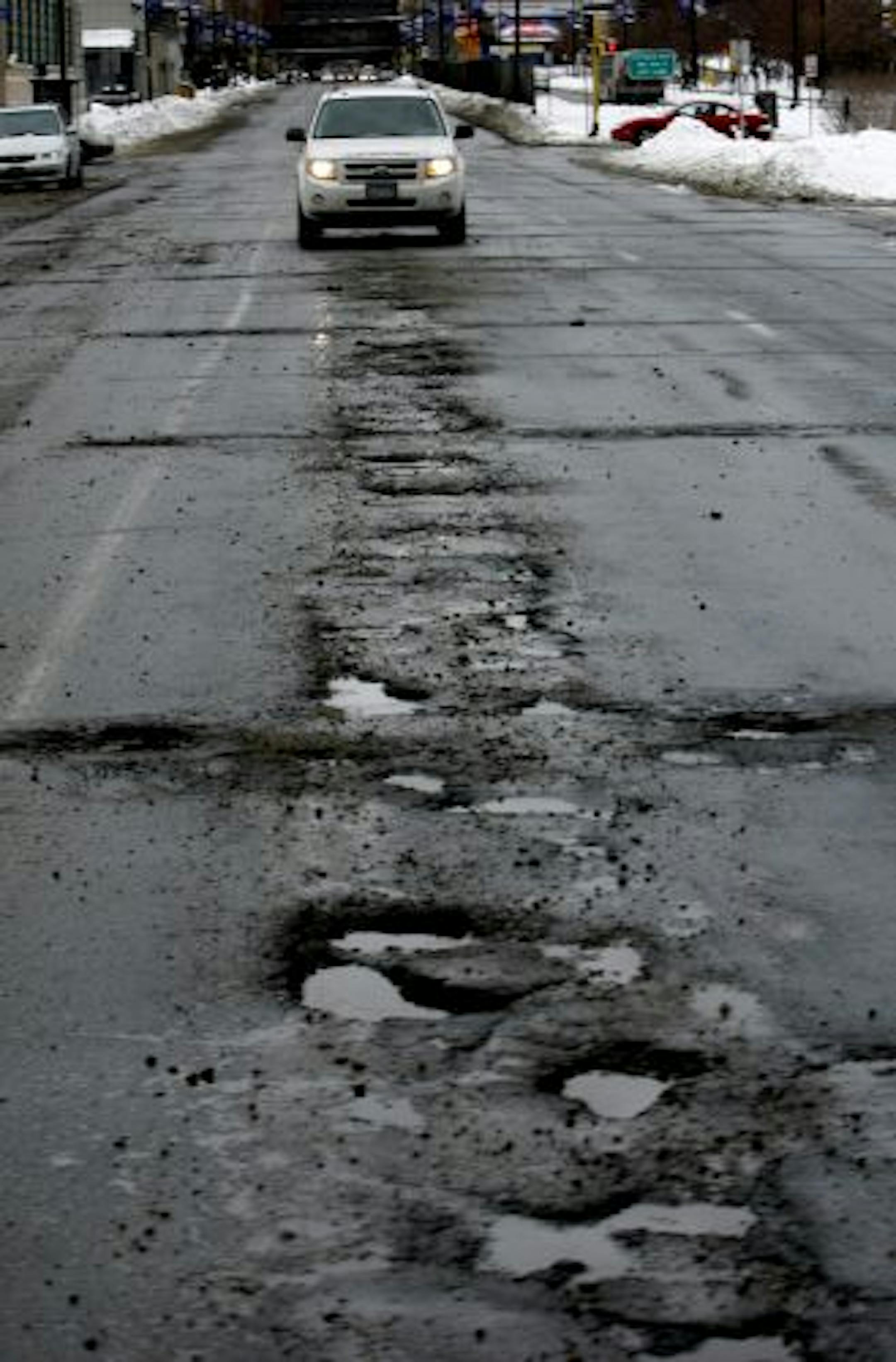 Roads are definitely bumpier than usual for February. Jaw-rattling potholes like these on 6th Street S. near Interstate 94 act like speed bumps for motorists in downtown Minneapolis.