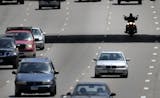 Seen from the 40th Street pedestrian bridge, a motorcylcist is sihlouetted beneath the 42nd Street Bridge while traveling north along I-35W, Friday, June 6, 2014, just south of downtown Minneapolis, MN.] (DAVIDJOLES/STARTRIBUNE) djoles@startribune.com A surge in deaths and injuries among motorcycle riders in Minnesota, coming just as summer-like weather takes hold, is prompting traffic officials to remind drivers across the vehicle spectrum of what they need to do to safely share the roads and h
