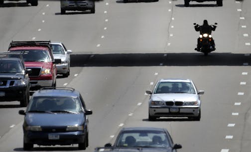 Seen from the 40th Street pedestrian bridge, a motorcylcist is sihlouetted beneath the 42nd Street Bridge while traveling north along I-35W, Friday, June 6, 2014, just south of downtown Minneapolis, MN.] (DAVIDJOLES/STARTRIBUNE) djoles@startribune.com A surge in deaths and injuries among motorcycle riders in Minnesota, coming just as summer-like weather takes hold, is prompting traffic officials to remind drivers across the vehicle spectrum of what they need to do to safely share the roads and h