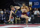 Gophers heavyweight Gable Steveson took down Michigan's Mason Parris en route to an 8-6 decision to win a Big Ten individual wrestling title in Piscat