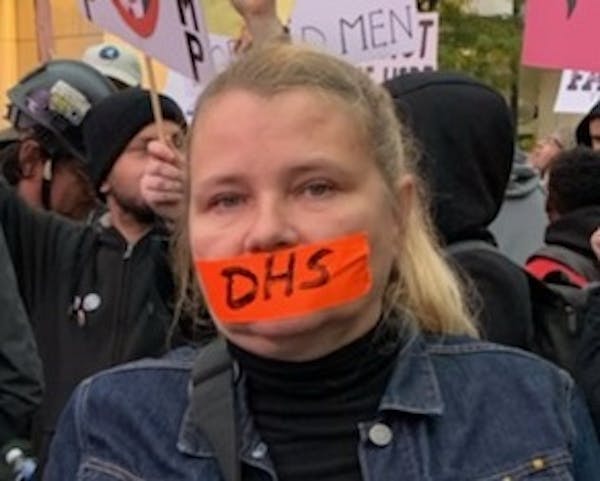 DHS compliance officer Faye Bernstein protested against mistreatment of whistleblowers outside of a rally for President Trump in Minneapolis.