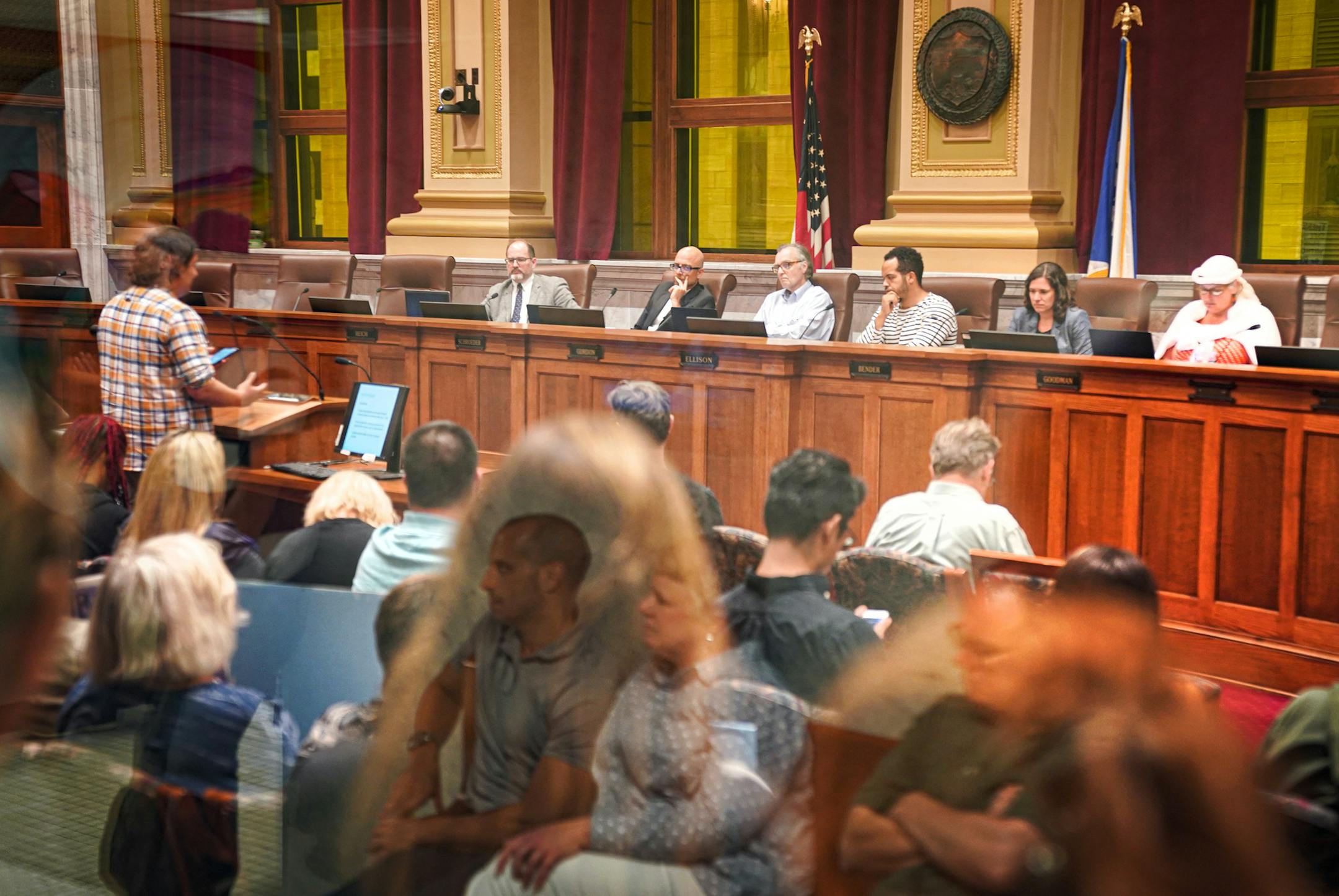 Overflow crowds watched testimony Wednesday for and against the new laws in the hallway outside Minneapolis City Council Chambers as well as inside the packed room inside.