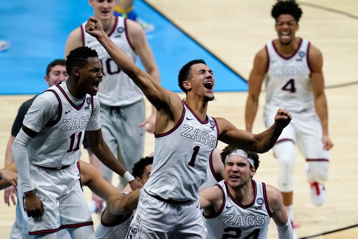 Gonzaga guard Jalen Suggs (1) celebrates making the game winning basket against UCLA during overtime in a men's Final Four NCAA college basketball tournament semifinal game, Saturday, April 3, 2021, at Lucas Oil Stadium in Indianapolis. Gonzaga won 93-90. (AP Photo/Michael Conroy)