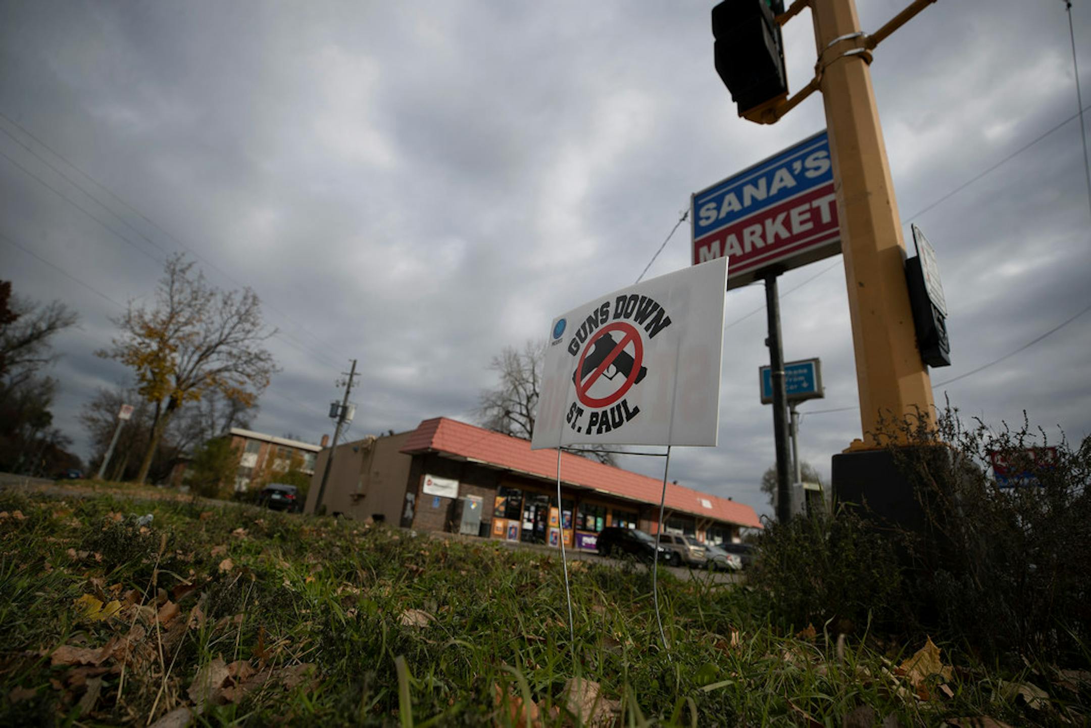 A "Guns Down St. Paul" sign was placed near the scene at E. Maryland Avenue and Hazelwood Street where a shooting happened over the weekend.
