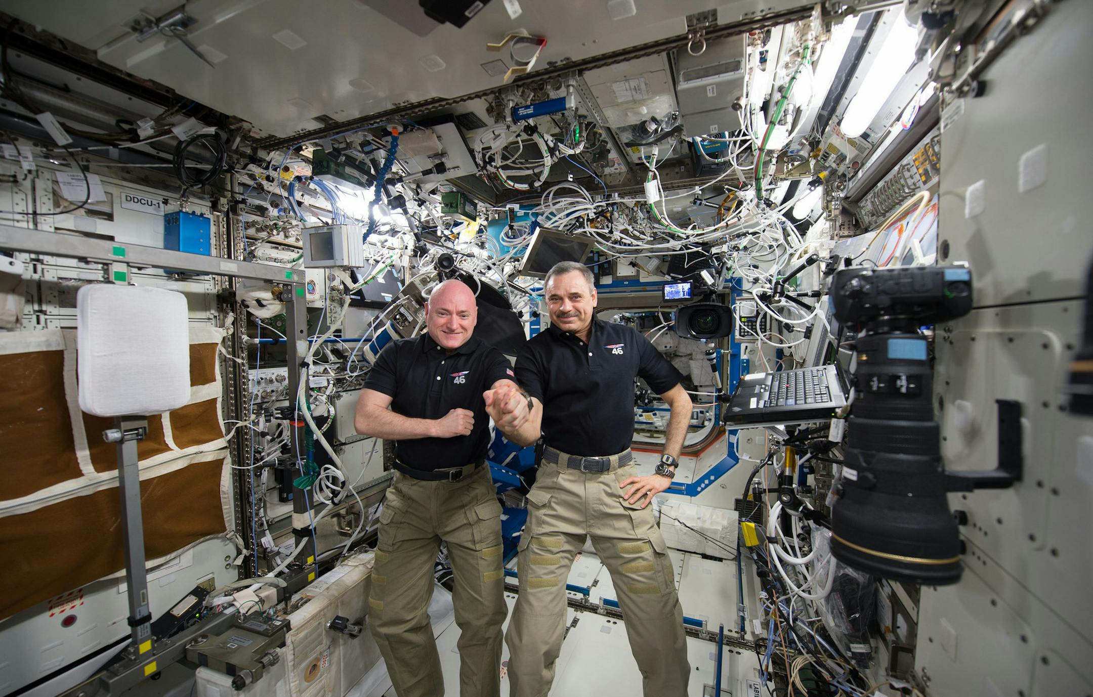 In this Jan. 21, 2016 photo made available by NASA, one-year mission crew members Scott Kelly of NASA, left, and Mikhail Kornienko of Roscosmos their 300th consecutive day in space. The pair will land March 1 after spending a total of 340 days in space. (NASA via AP)