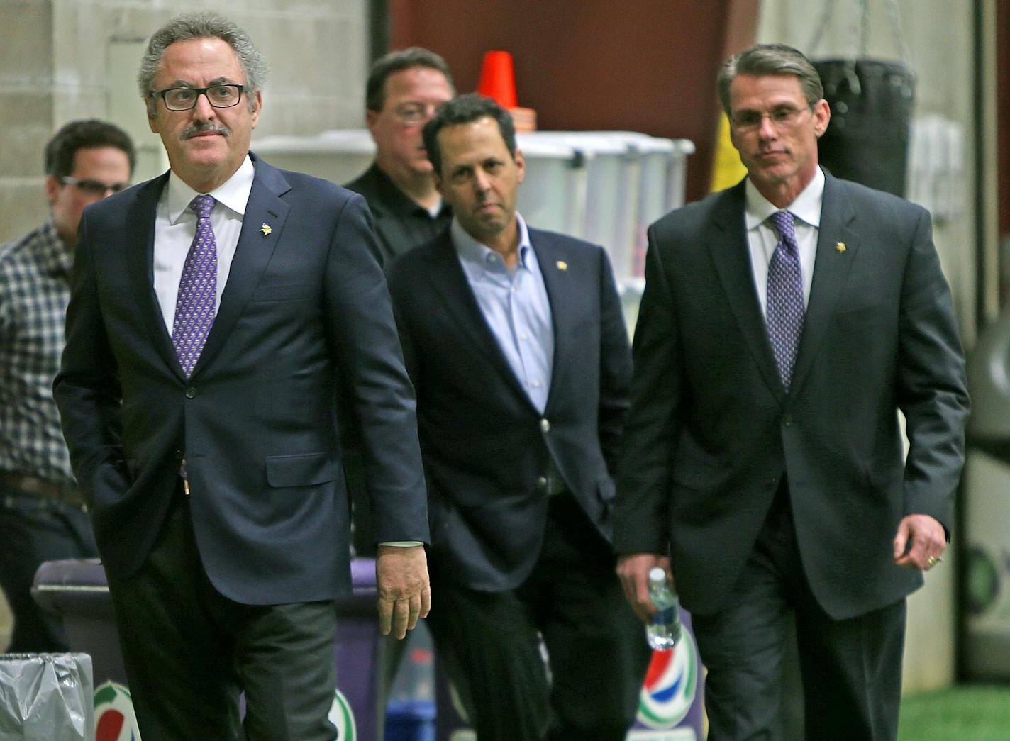 From left, Vikings owners Zygi and Mark Wilf, along with General Manager Rick Spielman, arrived for a news conference regarding the firing of head coach Leslie Frazier at Winter Park on Monday. "I understand how difficult change is for people," Spielman said. "… But I also know sometimes it also can bring a spark as well."