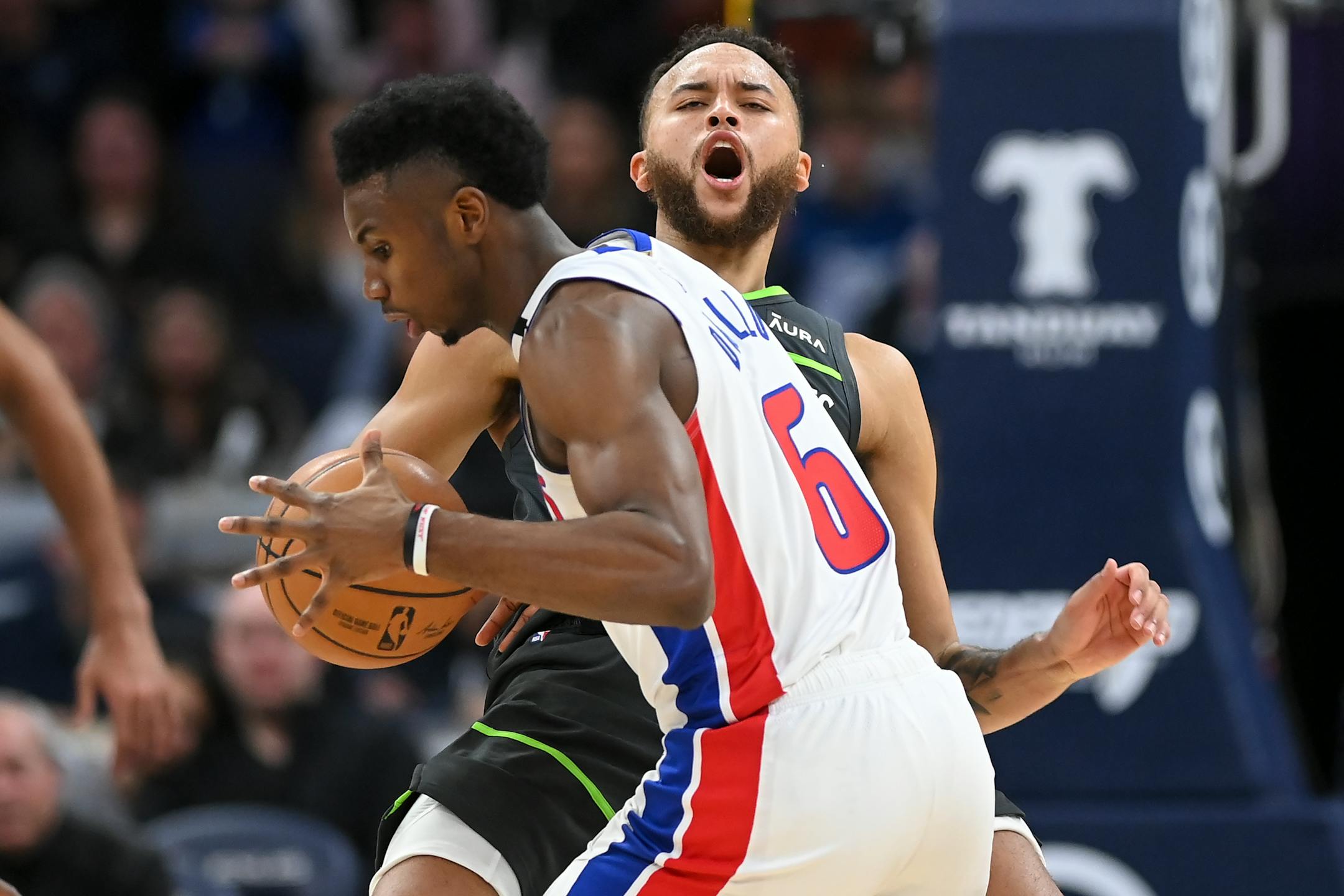 Detroit Pistons guard Hamidou Diallo (6) collides with Minnesota Timberwolves forward Kyle Anderson (5) for an offensive foul during the second half.