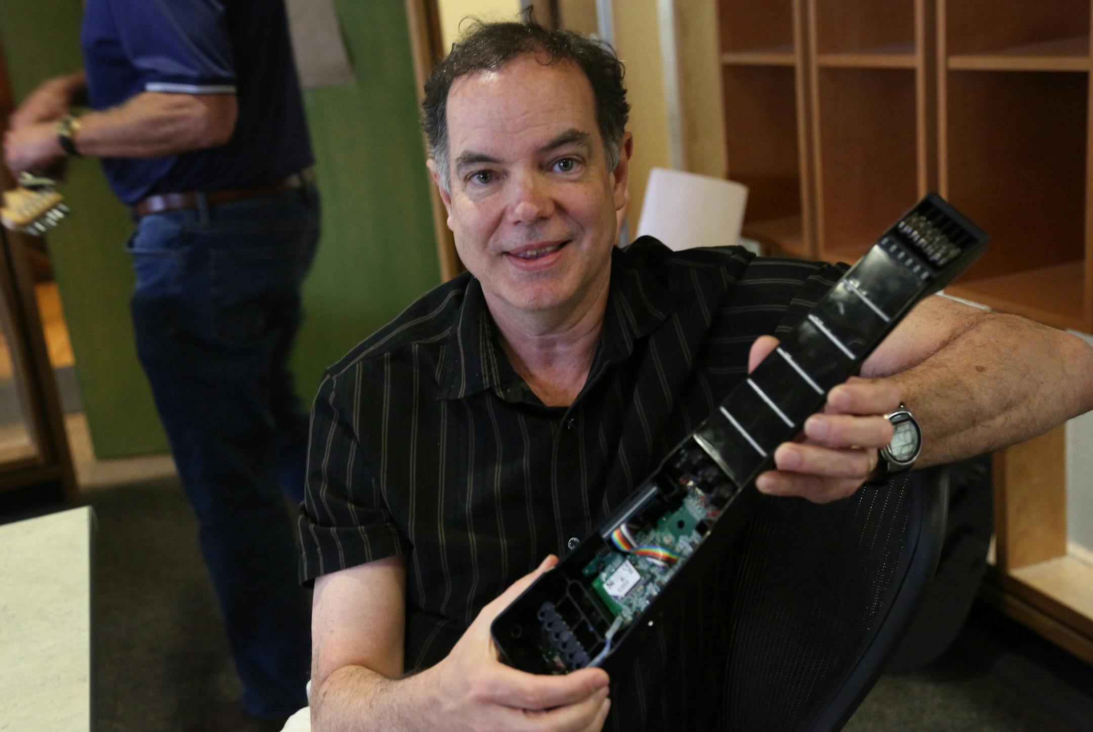 Dan Sullivan, founder of Zivix, held an opened up demo model of their product the JamStik. ] (KYNDELL HARKNESS/STAR TRIBUNE) kyndell.harkness@startribune.com Zivix is in the wireless music business. It makes the PUC, which wirelessly connects musical instruments to an iPad being used for composing. It also makes the JamStik, a portable instrument that mimics a guitar and connects wirelessly to an iPad in Minneapolis, Min.Thursday, June 12, 2014.