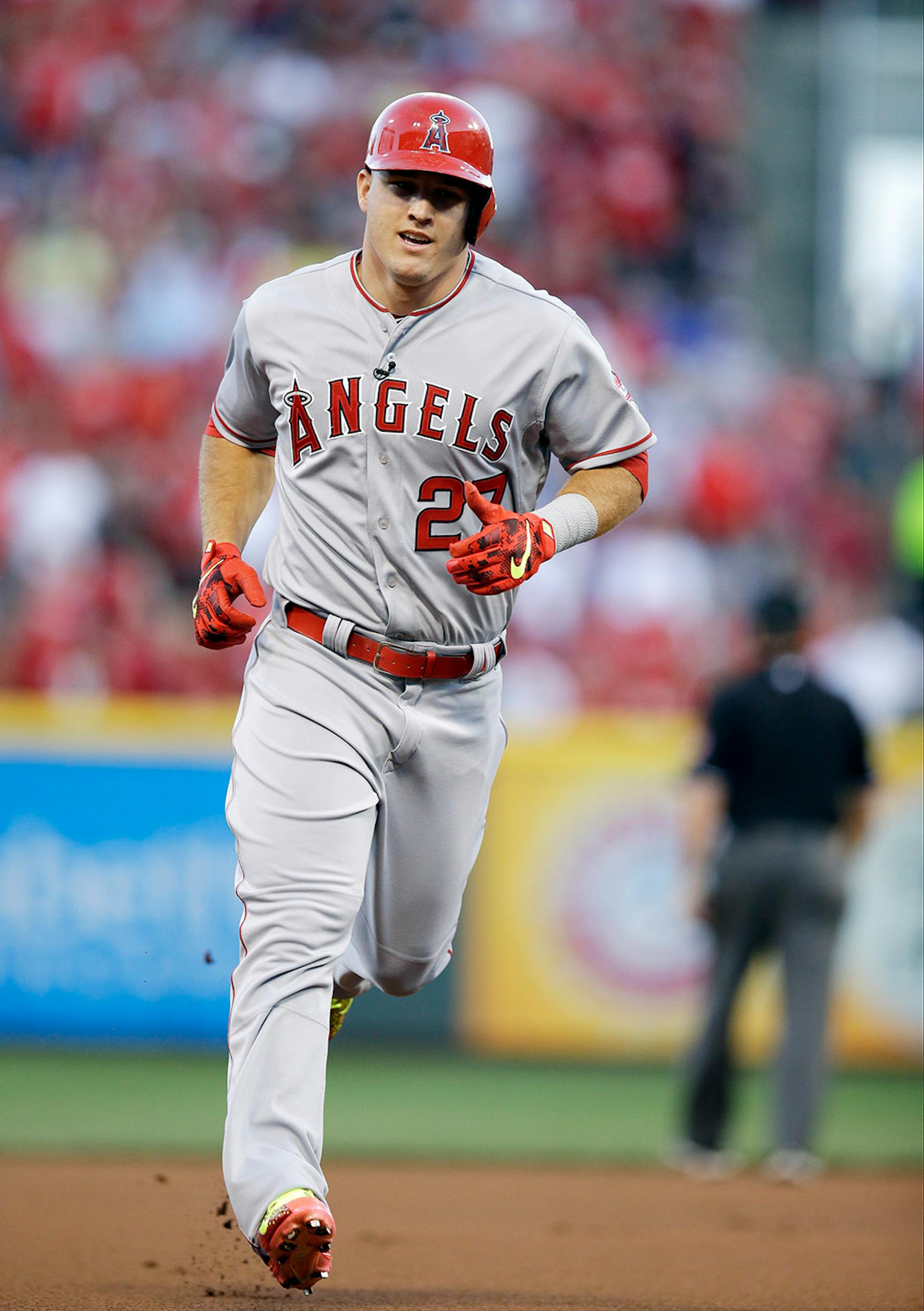 American League's Mike Trout, of the Los Angeles Angels, rounds the bases after hitting a home run during the first inning of the MLB All-Star baseball game, Tuesday, July 14, 2015, in Cincinnati.