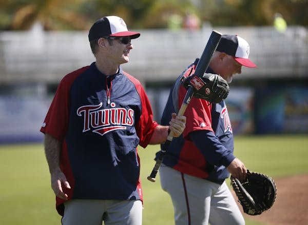 Twins coach Paul Molitor left and manger Ron Gardenhire shared a laugh after the first day of spring training Monday Feb 17. 2014 in Fort Myers, Flori