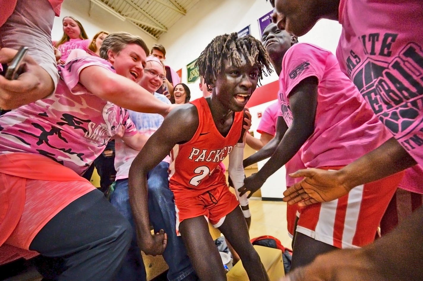 Agwa Nywesh celebrated in the student section after making a last-second basket to win Monday night's game against Mayo. He scored 30 points while wearing Kobe Bryant's No. 24, the day after Bryant was killed with his daughter and seven others in a helicopter crash.