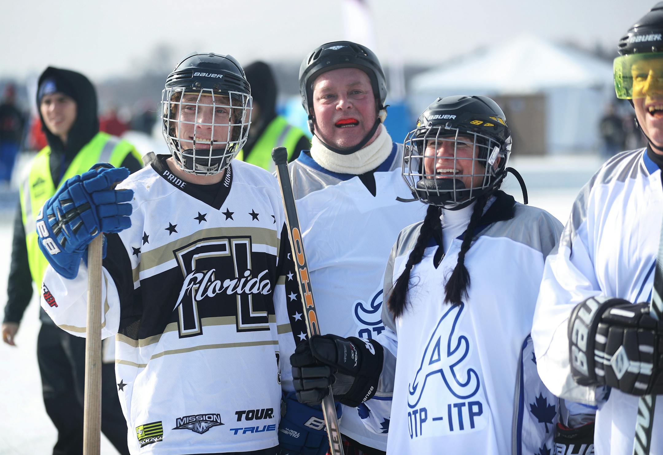 Free agent Dean Wolfe, left, came up from Florida to play on Atlanta OTP-ITP and was seen during a game Saturday, Jan. 27, 2018 at the U.S. Pond Hockey Championships on Lake Nokomis, in Minneapolis, MN. Wolfe was seen with team members after their early game win, including his father Todd, right.] DAVID JOLES ï david.joles@startribune.com What are the stories of the free agents who hope to come to MN to play in the pond hockey championships?