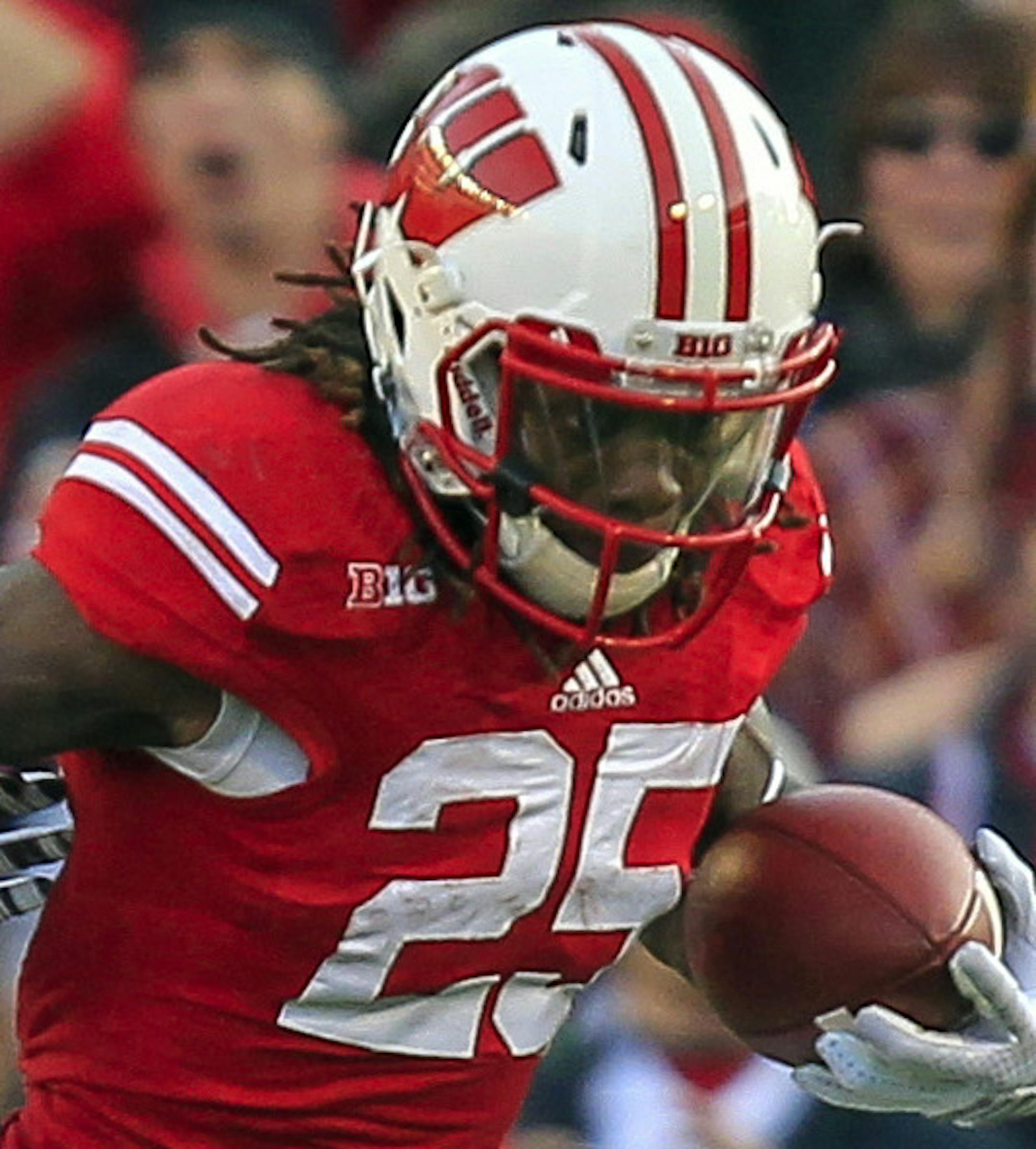 FILE - In this Nov. 29, 2014, file photo, Wisconsin's Melvin Gordon (25) runs against Minnesota's Brien Boddy-Calhoun during the first half of an NCAA college football game in Madison, Wis. No. 11 Wisconsin coach Gary Andersen said Melvin Gordon's right ankle is fine, though he will be keeping close tabs on his star running back as the Badgers prepare for the Big Ten title game against Ohio State. (AP Photo/Andy Manis, File)