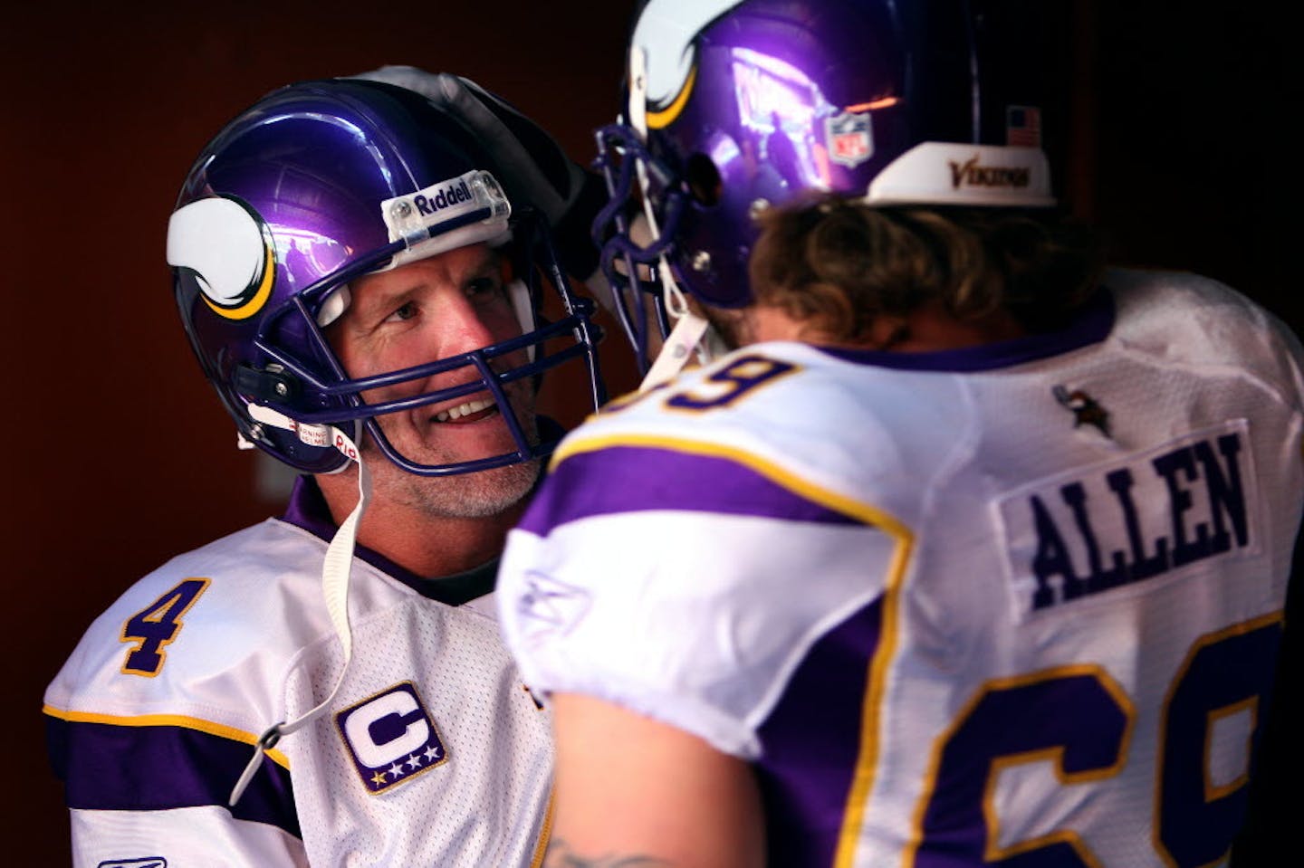 Brett Favre spoke with Jared Allen before taking the field prior to the start of a 2009 game.